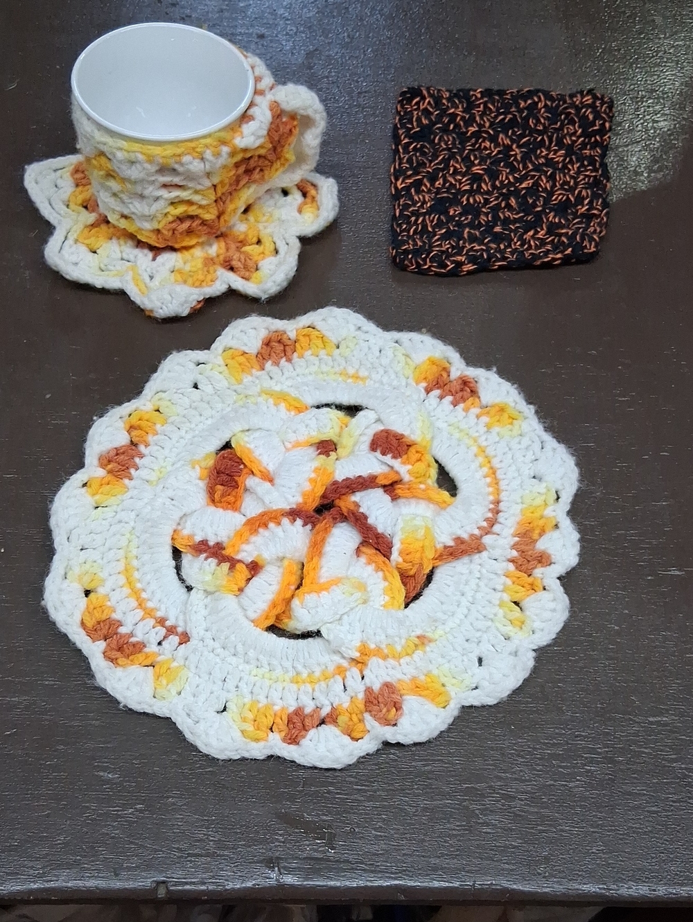 Cup & Saucer, hot pad holder or plant protector, & hot pad, all‎ hand crocheted.